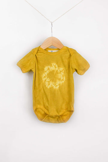 organic cotton onesie naturally dyed with plants shibori dyed with weld and marigolds
